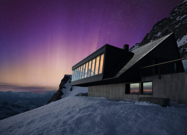 Cabane du Glacier de Tortin captured under a dazzling aurora.