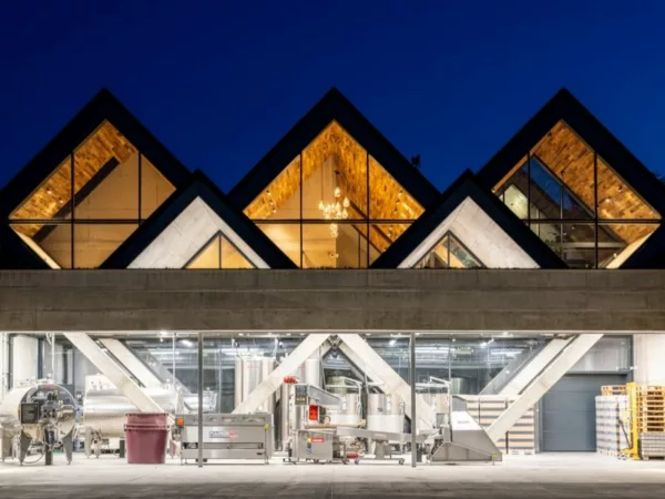 Night view of BudaPres Cider's exterior, revealing its two-floor design.