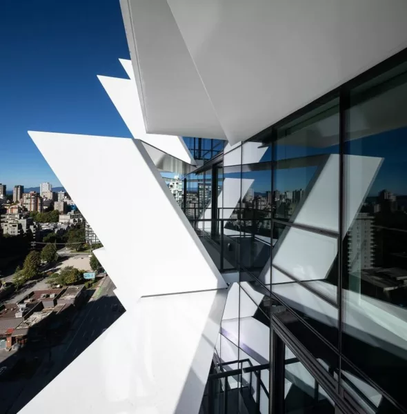 The CARDERO building, an emblem of innovative urban design by architecture firms in Vancouver, set against the city skyline.